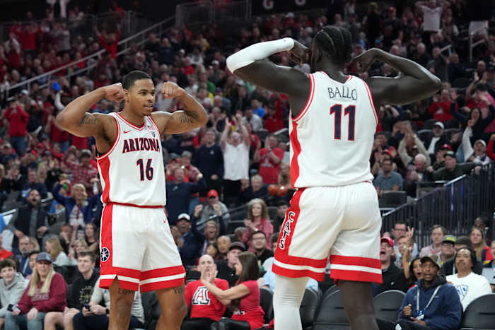 Mar 15, 2024; Las Vegas, NV, USA; Arizona Wildcats center Oumar Ballo (11) and forward Keshad Johnson (16) celebrate in the first half against the Oregon Ducks at T-Mobile Arena.